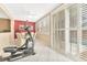 Bright workout room with exercise equipment and large sliding glass doors for seamless indoor/outdoor living at 5873 Wildhorse Ledge Ave, Las Vegas, NV 89131