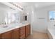 Bathroom featuring tile floors, double sink vanity, and soaking tub at 6430 Jackrabbit Run Ave, Las Vegas, NV 89122