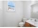 Bathroom with tiled floor, single sink, white walls and shuttered window at 6430 Jackrabbit Run Ave, Las Vegas, NV 89122