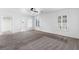 Bedroom with carpeted floor, bright white walls, ceiling fan, and plantation shutters at 6430 Jackrabbit Run Ave, Las Vegas, NV 89122