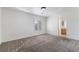 Bedroom featuring neutral walls, carpet flooring, and a window with plantation shutters at 6430 Jackrabbit Run Ave, Las Vegas, NV 89122