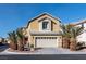 Charming two-story home featuring a two-car garage and desert landscaping at 6430 Jackrabbit Run Ave, Las Vegas, NV 89122