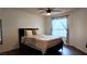 Bright bedroom featuring a ceiling fan and natural light from the large window at 6545 Bradford Ln, Las Vegas, NV 89108