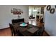 This dining room flows into the living room, which has hardwood floors and lots of natural light at 6545 Bradford Ln, Las Vegas, NV 89108