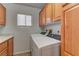 Well-organized laundry room with cabinets and modern washer and dryer at 6917 Leon Ave, Las Vegas, NV 89131