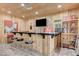 Cozy basement bar area features a tile countertop and rustic wood paneling, creating a unique space at 7220 Shenandoah Springs Ave, Las Vegas, NV 89131