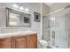 Bathroom featuring a glass door shower, wooden vanity, and framed mirror at 7220 Shenandoah Springs Ave, Las Vegas, NV 89131