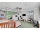 This bedroom features a ceiling fan, a tv and built in shelving at 7220 Shenandoah Springs Ave, Las Vegas, NV 89131