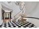 Grand foyer featuring a winding staircase and black and white tile at 7220 Shenandoah Springs Ave, Las Vegas, NV 89131