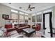 Cozy living room featuring a TV, comfortable seating, and unique brick floors at 7220 Shenandoah Springs Ave, Las Vegas, NV 89131