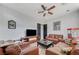 Comfortable living room with leather furniture, a popcorn machine, and a ceiling fan at 7220 Shenandoah Springs Ave, Las Vegas, NV 89131