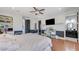 This main bedroom features hardwood floors, a ceiling fan, and access to the bathroom at 7220 Shenandoah Springs Ave, Las Vegas, NV 89131