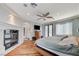 Luxurious main bedroom with a cozy fireplace, wooden floors, and large windows at 7220 Shenandoah Springs Ave, Las Vegas, NV 89131