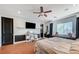 This main bedroom features hardwood floors, a ceiling fan, and a window seat at 7220 Shenandoah Springs Ave, Las Vegas, NV 89131