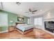 Bright main bedroom with wooden floors, fireplace, and ample natural light at 7220 Shenandoah Springs Ave, Las Vegas, NV 89131