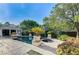 Inviting backyard pool and spa area surrounded by lush landscaping and a covered lounge at 7220 Shenandoah Springs Ave, Las Vegas, NV 89131