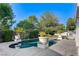 Beautifully designed pool area featuring potted palms and a serene swimming space at 7220 Shenandoah Springs Ave, Las Vegas, NV 89131