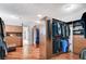 Large walk-in closet with hardwood floors, custom cabinets, and bench at 7220 Shenandoah Springs Ave, Las Vegas, NV 89131