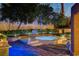 Backyard spa area with elegant lighting and lush landscaping at 7607 Boca Raton Dr, Las Vegas, NV 89113