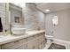 Stylish bathroom features a vessel sink, decorative mirror, and modern wavy wall texture at 7607 Boca Raton Dr, Las Vegas, NV 89113