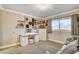 Inviting bedroom with a large window, vanity, and shelves for displaying cherished items at 7607 Boca Raton Dr, Las Vegas, NV 89113