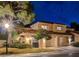 Charming two-story stucco home with a tile roof, well-manicured landscaping, and a two-car garage at 7607 Boca Raton Dr, Las Vegas, NV 89113