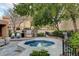 View of outdoor spa with outdoor kitchen, Stainless steel grill and outdoor seating at 7607 Boca Raton Dr, Las Vegas, NV 89113