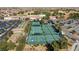 An aerial view of the resort features tennis and pickle ball courts and manicured landscaping at 7828 Homing Pigeon St, North Las Vegas, NV 89084