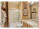 Cozy bathroom with a shower-tub combo, granite vanity and decorative accents at 7828 Homing Pigeon St, North Las Vegas, NV 89084