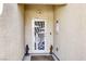 Intricate front door featuring a charming design and decorative statues on each side at 7828 Homing Pigeon St, North Las Vegas, NV 89084