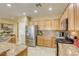 Kitchen with stainless steel appliances, granite countertops and tile backsplash at 7828 Homing Pigeon St, North Las Vegas, NV 89084