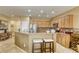 Kitchen with stainless steel appliances, breakfast bar, and granite countertops at 7828 Homing Pigeon St, North Las Vegas, NV 89084