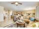 Inviting living room featuring tile floors, neutral walls and comfortable, upscale furnishings at 7828 Homing Pigeon St, North Las Vegas, NV 89084