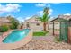 This backyard offers a pool, gazebo, and lush landscaping, ideal for relaxation at 8324 Shark Tank Ct, Las Vegas, NV 89128