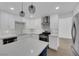 Well-lit kitchen with stainless appliances, ample cabinets, and a functional island at 8324 Shark Tank Ct, Las Vegas, NV 89128