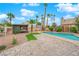 Relaxing pool with mature landscaping and pavers create an outdoor oasis at 8324 Shark Tank Ct, Las Vegas, NV 89128