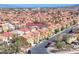 Expansive aerial view of the residential community featuring uniform homes with red-tiled roofs and well-maintained streets at 840 Sheerwater Ave, Henderson, NV 89052