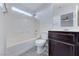 Clean bathroom featuring white tile and a vanity with storage at 840 Sheerwater Ave, Henderson, NV 89052