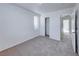 Bedroom featuring neutral carpet, a closet, and an open doorway at 840 Sheerwater Ave, Henderson, NV 89052