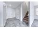 Bright entrance foyer with tile flooring, a staircase, and access to the main living areas at 840 Sheerwater Ave, Henderson, NV 89052