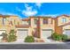 Charming two-story home with a Spanish-tile roof, desert landscaping, and an attached two-car garage at 840 Sheerwater Ave, Henderson, NV 89052