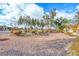 Front yard circular garden with rock cover, lush bushes and plenty of tree coverage at 840 Sheerwater Ave, Henderson, NV 89052