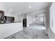 Bright living room featuring an adjacent kitchen space, tile flooring and stainless steel appliances at 840 Sheerwater Ave, Henderson, NV 89052