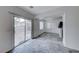 Bright living room features tile flooring, neutral paint, and sliding glass door leading to backyard at 840 Sheerwater Ave, Henderson, NV 89052