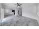 Open-concept living room with tile flooring, neutral paint, and view into the kitchen at 840 Sheerwater Ave, Henderson, NV 89052