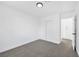 Bedroom features gray carpet, white walls, a closet and an open view to an additional closet at 8979 Green Jade Dr, Las Vegas, NV 89129