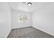 Bright bedroom featuring gray carpet, white walls, and a window with natural light at 8979 Green Jade Dr, Las Vegas, NV 89129