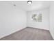 Cozy bedroom with gray carpet, white walls, and window offering neighborhood views at 8979 Green Jade Dr, Las Vegas, NV 89129