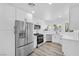 Modern kitchen featuring stainless steel appliances, white cabinets, and ample counter space at 8979 Green Jade Dr, Las Vegas, NV 89129