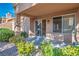 The covered back patio features desert landscaping and access to interior via sliding glass door at 9001 Marble Dr, Las Vegas, NV 89134